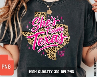 May include: Dark grey t-shirt featuring a pink and leopard print Texas graphic with the text "She's From Texas". The graphic includes the text "I can tell" and star accents. The shirt is a high-quality 300 DPI PNG.