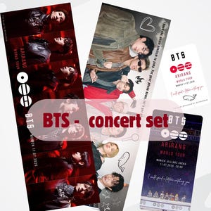 Peut inclure: Un ensemble de concert avec des images d'un groupe de musique, avec le texte "BTS - concert set". L'ensemble comprend plusieurs cartes et un marque-page avec le texte "ARIRANG WORLD TOUR MUNICH 11.07.2026."