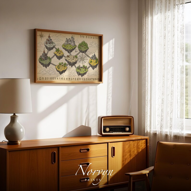 May include: A framed print featuring a fantasy map with floating islands, castles, and trees, in a wooden frame. The print has a vintage aesthetic with text at the top and bottom. The print is hanging on a white wall above a wooden cabinet. The cabinet has a lamp and a vintage radio on top.