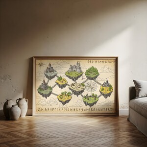 May include: Framed fantasy map featuring floating islands with castles, trees, and bridges. The map has a vintage aesthetic with a compass rose and runic text. The artwork is in a wooden frame, leaning against a wall.