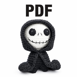 May include: A crocheted doll in the shape of a grim reaper, with a white head, black eyes, and a stitched smile. The doll is wearing a black hooded cloak. The word "PDF" is printed in large, black letters above the doll.