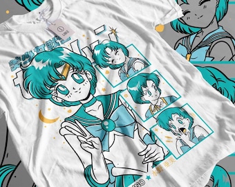 May include: White t-shirt featuring a teal-haired anime character in a sailor uniform. The design includes multiple panels with the character in different poses, along with Japanese text and stars. The shirt has a tag attached.