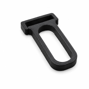 May include: A black, 3D-printed plastic handle featuring a rectangular top bar with a wide slot and a rounded, elongated loop extending downwards. The object has a matte, textured finish and a rigid, hollow structure designed for gripping.