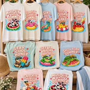 May include: A collection of summer-themed t-shirts in various colors, each featuring a unique graphic and text. Designs include a cow in a watermelon, a flamingo, a seahorse, a duck, a crab, an otter, an alligator, a turtle, and a pelican.