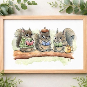 May include: A framed watercolor print featuring three cartoon squirrels sitting on a branch, each reading a book. One squirrel wears a green sweater, another wears an acorn hat, and a third has a mug with an acorn design. The artwork is in a wooden frame.