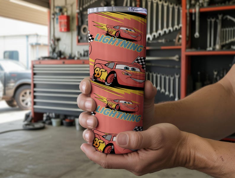 May include: A red tumbler featuring the character Lightning McQueen from the movie Cars. The tumbler has a repeating pattern of the character with the text "Lightning" and the number "95". The background is a yellow and black design.