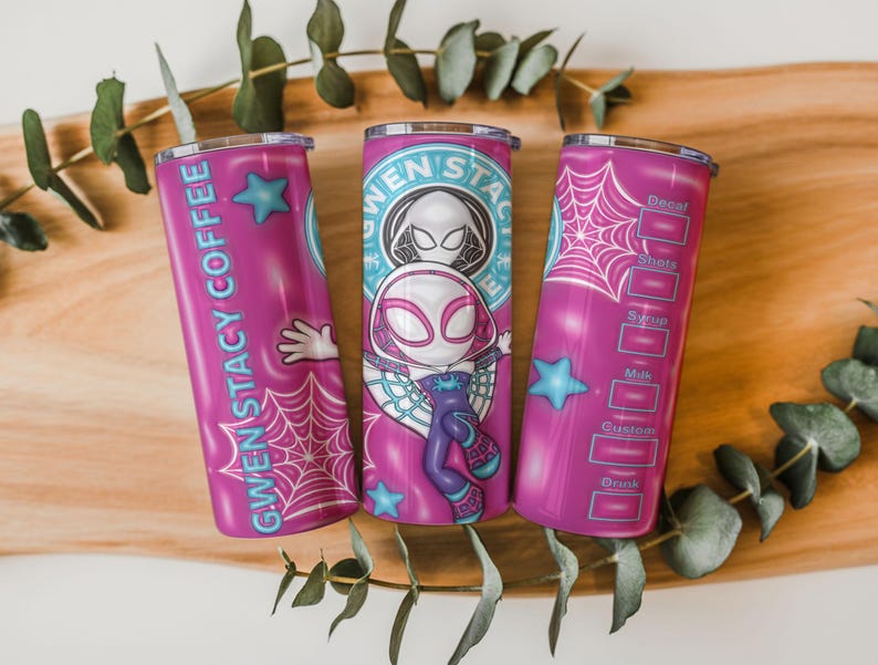 May include: Three pink Gwen Stacy Coffee tumblers with a cartoon Spider-Gwen design. The tumblers feature a spider web, a blue star, and the words "Gwen Stacy Coffee" and "Decal, Shots, Syrup, Milk, Custom, Drink" in white.