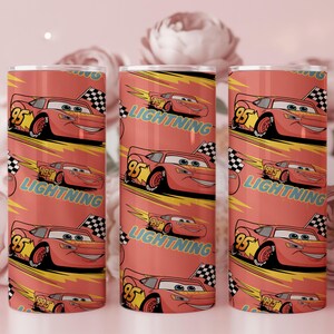 May include: Three red insulated tumblers featuring a repeating pattern of the character Lightning McQueen from the movie Cars. Each tumbler has a red background with the words "Lightning" and "95" on the design. A checkered flag is also included.