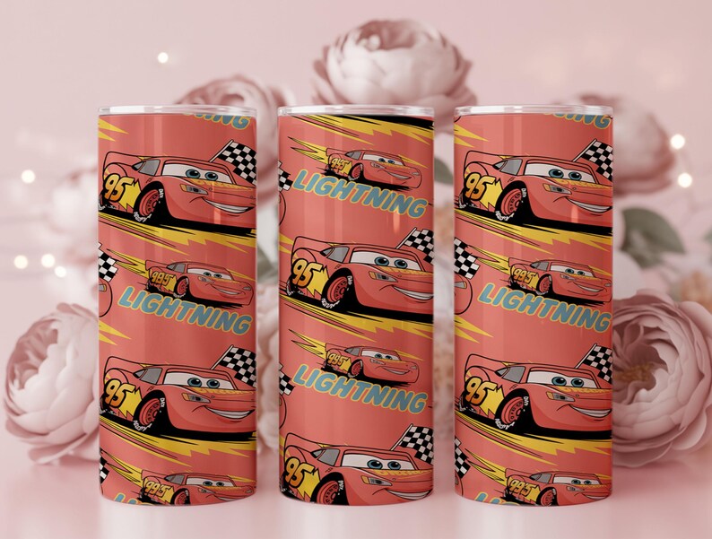 May include: Three red insulated tumblers featuring a repeating pattern of the character Lightning McQueen from the movie Cars. Each tumbler has a red background with the words "Lightning" and "95" on the design. A checkered flag is also included.