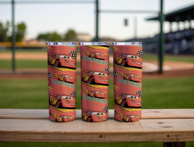 May include: Three stainless steel tumblers with a repeating pattern of the character Lightning McQueen from the animated movie Cars. The tumblers are red with yellow and black accents and the text "Lightning".