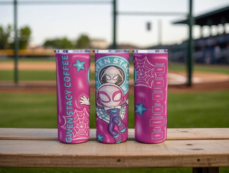 May include: Three pink stainless steel tumblers with Gwen Stacy Spider-Woman designs. One tumbler has the text "Gwen Stacy Coffee" and a hand graphic. Another features the Spider-Woman logo. The third has a coffee recipe chart.