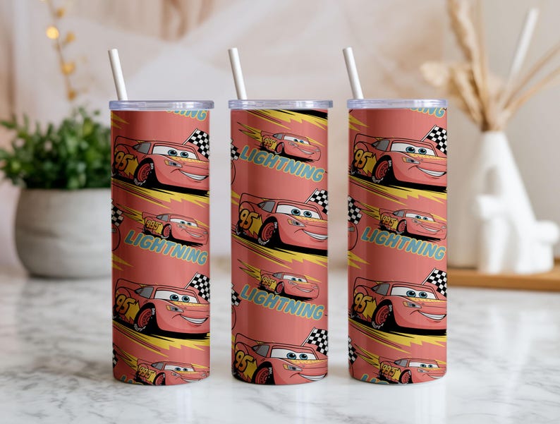 May include: Three red insulated tumblers with white straws. Each tumbler features a repeating pattern of Lightning McQueen from the Cars movie, the number 95, and the word "Lightning". The background is a reddish-orange color.