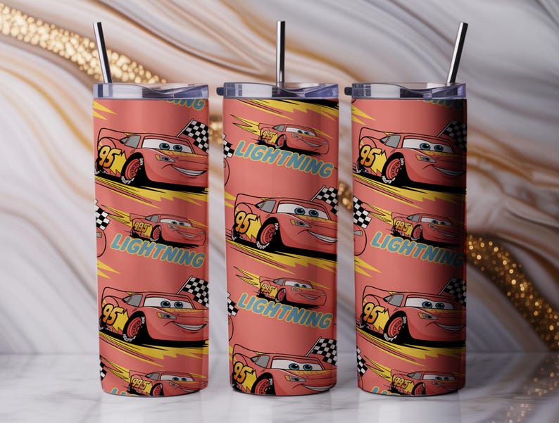 May include: Three stainless steel tumblers with a repeating pattern of the character Lightning McQueen from the movie Cars. The design features the number 95, a checkered flag, and the word "Lightning" on a coral background. Each tumbler has a silver straw.