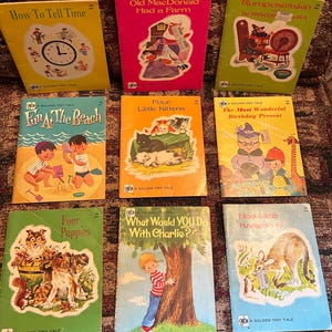 May include: A collection of nine vintage Golden Tiny Tale children's books featuring illustrated covers with titles including How To Tell Time, Old MacDonald Had a Farm, Rumpelstiltskin, Fun At The Beach, Four Little Kittens, The Most Wonderful Birthday Present, Four Puppies, What Would You Do With Charlie?, and Hop Little Kangaroo!
