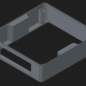 May include: A gray, rectangular plastic enclosure with a hollow interior. The enclosure has a rectangular opening on one side and a cylindrical post on the inside. The design is a 3D rendering.