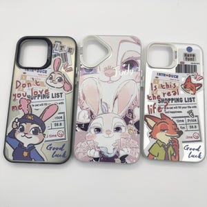 May include: Three phone cases featuring cartoon characters. The first case has a bunny in a police uniform with text that reads "Don't you love me?" and "Good luck." The second case has a bunny holding money with the name "Judy." The third case has a fox with the text "Is this the real shopping list?"