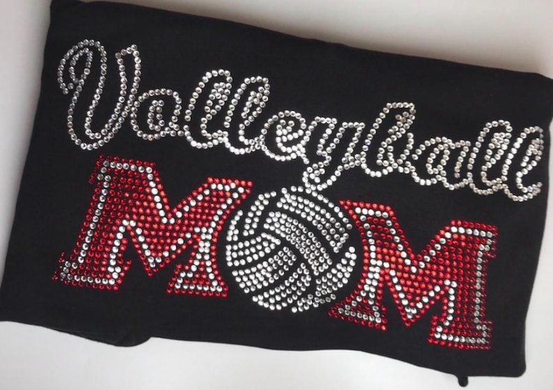 Sparkly Rhinestone Apparel Volleyball Mom Shirt Custom Crystal Design Team Colors Option Athletic Support Wear Personalized Glitter Details Game Day Fashion Statement Parent Gift Idea Special Occasion Clothing Unique Bling Creation Sports
