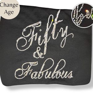 May include: A handmade wooden sign with the text "Welcome to our home" in a handwritten style. The sign is painted white with a distressed finish and a dark brown border. A small, decorative heart is attached to the bottom.