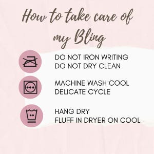 May include: A pink and white graphic with care instructions for items labeled "Bling." Text includes "Do Not Iron Writing," "Machine Wash Cool, Delicate Cycle," and "Hang Dry, Fluff in Dryer on Cool."