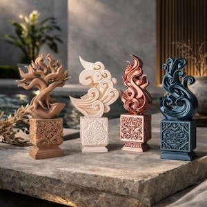 May include: Four decorative sculptures. A brown tree, a white cloud, a copper flame, and a blue wave. Each sits on a square, ornate base. The sculptures are arranged in a row, showcasing a variety of designs and colours.