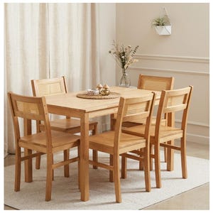 May include: A light wood dining set featuring a square table and four chairs. The chairs have woven cane backs. The table is set with a woven placemat and decorative items. The room has neutral tones and a minimalist aesthetic.