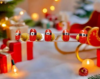 Le traîneau du père Noël presse sur les ongles