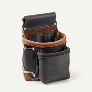 May include: A leather tool belt with multiple pockets and compartments. The belt is primarily black and brown, with a tan interior and a silver metal clip. The design includes a large pouch and smaller pockets for tools.