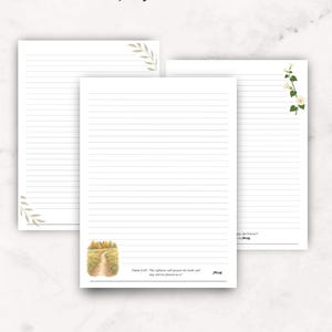 May include: Three sheets of lined stationery paper with decorative elements. One features a leafy branch, another has white flowers, and the third displays a path through an autumn forest with the text Psalm 37:29 and JW.org at the bottom.