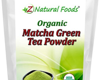 May include: A white pouch with a label featuring the text "Z Natural Foods Organic Matcha Green Tea Powder." The label includes a bowl of green powder, a wooden spoon, and the USDA Organic seal. Net weight is 4 oz (113.4 g).