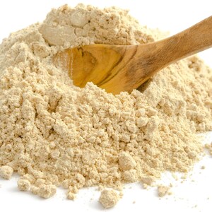 Image of ashwagandha root powder and a wooden spoon