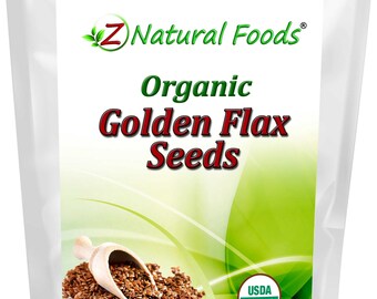 May include: A white bag of Z Natural Foods Organic Golden Flax Seeds. The bag features a green and white label with the USDA Organic seal. A wooden scoop holds a pile of brown flax seeds. Net weight is 3 lbs (1.36 kg).