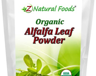 May include: A white pouch with a label featuring the text "Z Natural Foods Organic Alfalfa Leaf Powder." The label includes a green leaf illustration and the USDA Organic seal. The net weight is 1 lb (454 g).