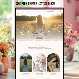 May include: A Shopify website theme, "Cottage Bloom," is displayed on a screen. The design uses a pink and white palette. The homepage features a woman in a field with the words "Float Away." Below are three categories: Floral Furnishings, Cottagecore Fashion, and Self-Care Rituals.