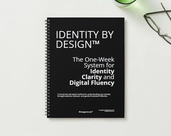Pode incluir: Um caderno preto com espiral com o título "IDENTITY BY DESIGN™" em texto branco. O subtítulo diz "The One-Week System for Identity Clarity and Digital Fluency." Texto adicional é visível na parte inferior. O caderno está sobre uma superfície branca.