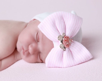 Princess Carriage Newborn Hospital Hat, white hat with a pink stripe bow & pink and rhinestone carriage from Lil Miss Sweet Pea Boutique