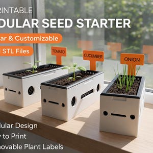 May include: A 3D-printed modular seed starter with three rectangular planters. Each planter contains soil and a seedling, labeled with orange tags: Tomato, Cucumber, and Onion. The design is modular and customizable, with removable plant labels. The text "3D PRINTABLE MODULAR SEED STARTER" is at the top.