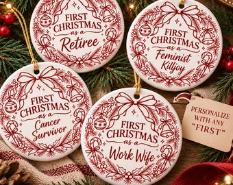 May include: Four round white ceramic ornaments with red ink designs featuring a wreath, bow, bell, and candy canes. The text reads: First Christmas as a Retiree, First Christmas as a Feminist Killjoy, First Christmas as a Cancer Survivor, and First Christmas as a Work Wife. A tag says: PERSONALIZE WITH ANY FIRST.