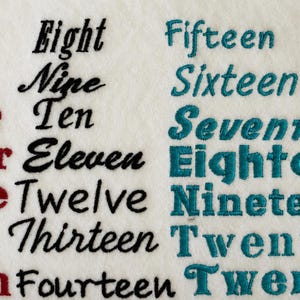 May include: An embroidery sample on white fabric featuring the words One through Seven in red, Eight through Fourteen in black, and Fifteen through Twenty 1 in teal. Each word is stitched in a different font style, showcasing various lettering designs.
