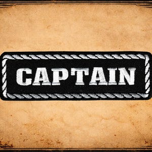 May include: A set of three ceramic mugs with a speckled, matte finish. The mugs are in shades of cream, light gray, and dark gray. Each mug has a simple, minimalist design and a rounded handle.