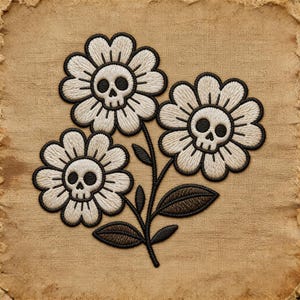 May include: Embroidered patch featuring three white flowers with black outlines and skull centers. The flowers are on a black stem with black leaves, set against a tan background with a distressed edge. The patch has a unique, gothic aesthetic.