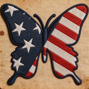 May include: Embroidered butterfly patch featuring the American flag design. One wing displays the blue field with white stars, while the other showcases red and white stripes. The patch has a dark blue border and is set against a tan background.