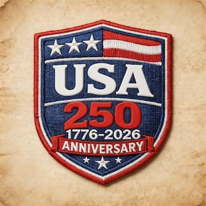 May include: A patriotic patch in a shield shape, featuring the text "USA 250" in white and red, with the years "1776-2026" and the word "ANNIVERSARY". The patch has a blue background with white stars and a red and white striped design.