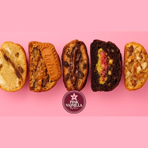 May include: An overhead shot of five different halves of baked goods, each with a unique filling. The baked goods are arranged on a pink background. The logo for Pink Vainilla is at the bottom. The baked goods include cookies and cakes.