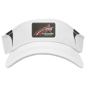 May include: White visor with a curved brim and black accents. A rectangular patch features a red star, the number "250", and the word "FREEDOM" in white text. The text "250 EST. 1776" is also included.