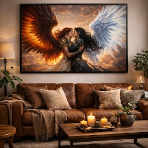 May include: A framed artwork depicts two figures embracing and kissing, one with fiery orange wings and the other with white wings. The figures are set against a cloudy, sunset-like sky. The artwork hangs above a brown leather sofa.