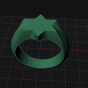 Könnte beinhalten: Ein 3D-gerenderter grüner Ring mit einem sechszackigen Stern-Design. Der Ring hat ein dickes Band und eine geometrische Form. Er wird auf einem schwarzen Gitterhintergrund angezeigt.