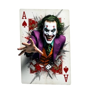 May include: Ace of Spades playing card featuring the Joker character. The Joker is depicted with green hair, white face paint, and a purple suit, emerging from a torn background. The card has red accents and a spade symbol.