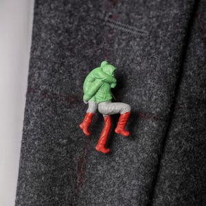 May include: A set of three ceramic mugs with a speckled, matte finish. The mugs are in shades of cream, light gray, and dark gray. Each mug has a simple, minimalist design, perfect for coffee or tea.