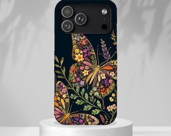May include: A black smartphone case featuring a vibrant design of two butterflies with wings composed of various small orange, yellow, purple, and white flowers, surrounded by green leafy stems against a dark navy blue background.