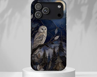 May include: A smartphone case featuring a dark blue night scene with a perched owl, silhouetted pine trees, and a full moon. The design includes intricate gold-toned line work detailing the branches and leaves against a deep navy background.